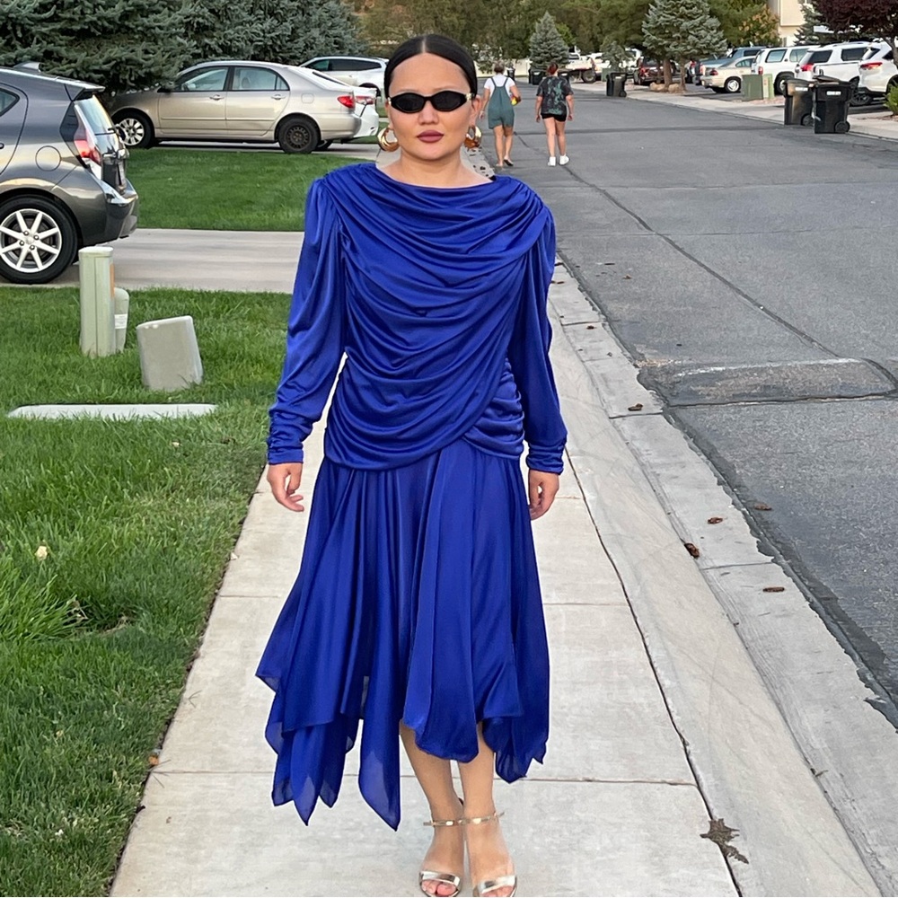 80s cobalt blue disco dress by Filigree—stretchy, flowing, statement piece